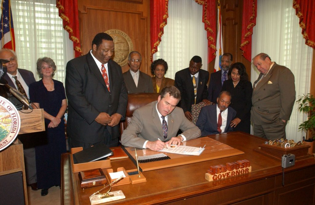 Governor Bush signs a proclamation reinstating James Dean as a judge. [S2112, Governor (1999-2007, Bush) Speech and remark files and recordings, 02-26-02]