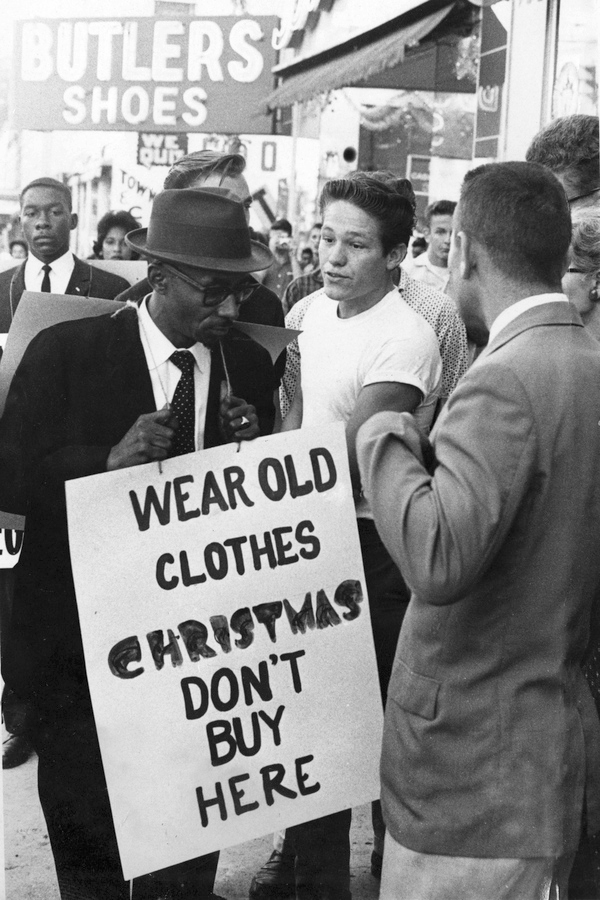 Rev. C.K. Steele picketing downtown stores during demonstration in Tallahassee.