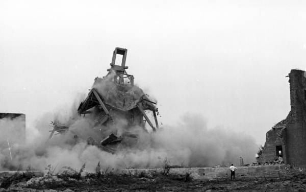 Clouds of dust fill the air as the cupola of the unfinished Ringling Ritz-Carlton Hotel collapses during demolition (1964).