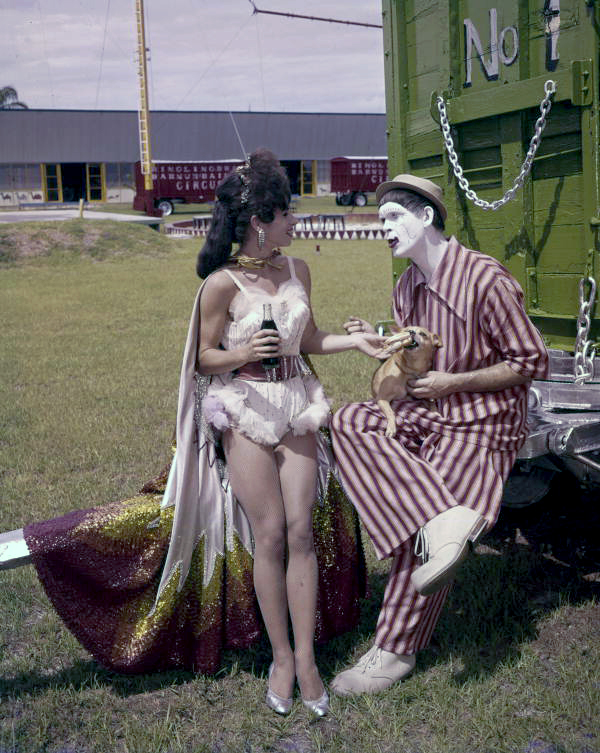 Aerialist Carmen del Molino with Bob-O the clown and small dog on the grounds of the Circus Hall of Fame in Sarasota, Florida.