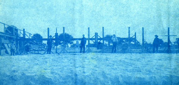 Koreshans setting up "The Air Line" rectilineator on the beach in Naples, Florida.