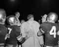 Coach Nugent and FSU football team celebrating victory in Tallahassee, Florida.
