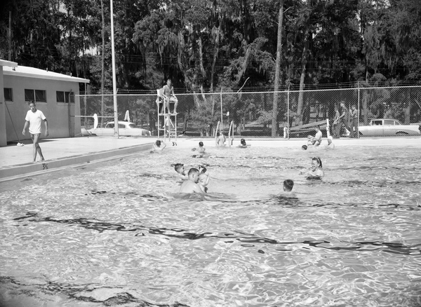 People cooling off in a Tallahassee community pool.