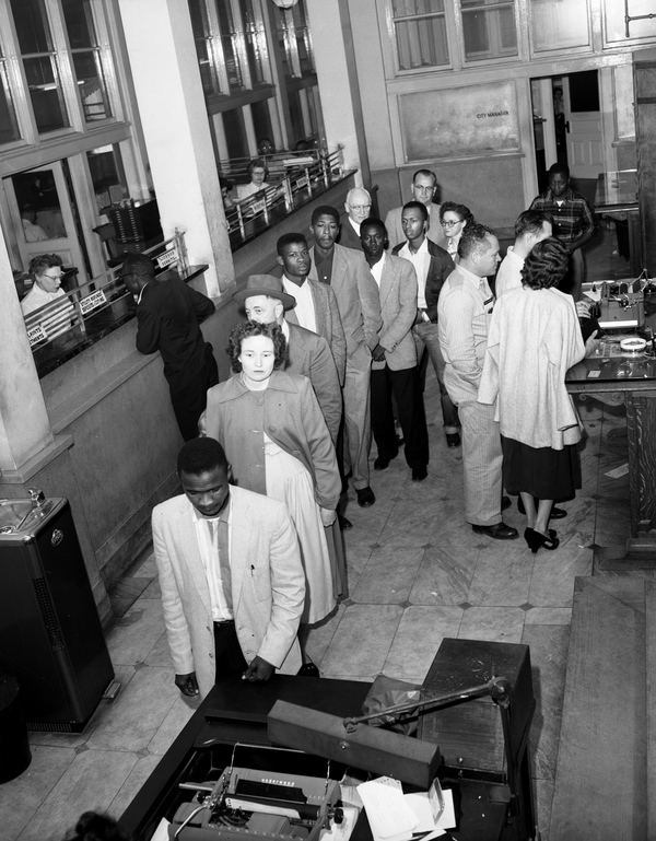 African American and white voters registering together at City Hall in Tallahassee, Florida.
