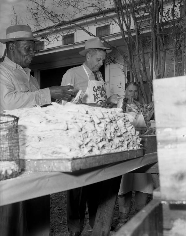 Men preparing to fry mullet for the Harbor Day Seafood Festival in Apalachicola (1957).