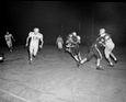 Burt Reynolds running the ball for FSU during football game against Furman University in Tallahassee, Florida.