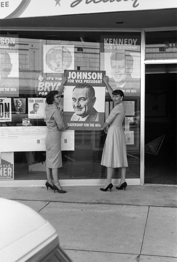 Kennedy-Johnson supporters putting up poster at the Leon County Democratic Party headquarters in Tallahassee.