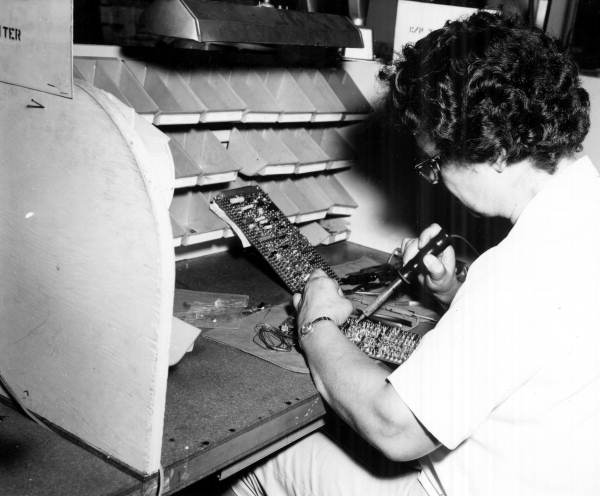 Woman soldering at the Martin-Marietta electronics company in Orlando, Florida.