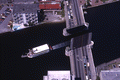 Aerial view showing boat passing by the Kennedy Boulevard Bridge in Tampa.