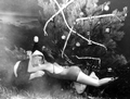 Mary Dwight rewards Santa (Newt Perry) with a hug after receiving an underwater present - Weeki Wachee, Florida.
