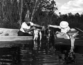 Al Zaebst and Howe Sadler comparing catches during a fishing contest - Weeki Wachee Spring, Florida.