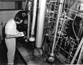 Research chemist O.G. Wilson records experimental processes in the company's laboratory - Pensacola, Florida.