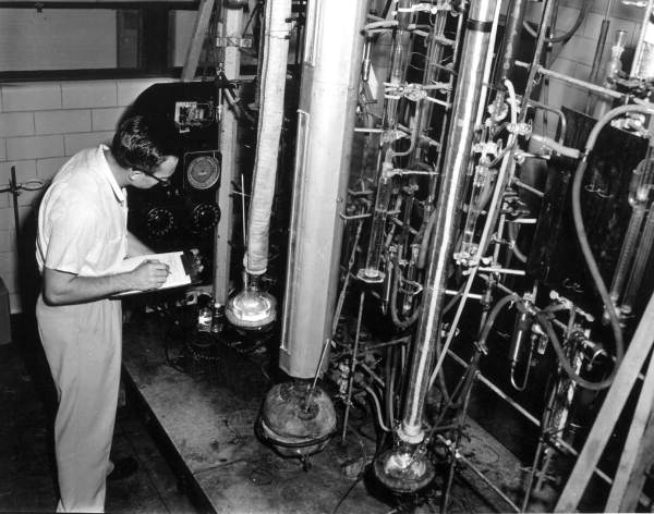 Research chemist O.G. Wilson records experimental processes in the company's laboratory - Pensacola, Florida.