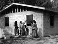 Charlotte Osceola proudly shows off her new American style home being built by her husband