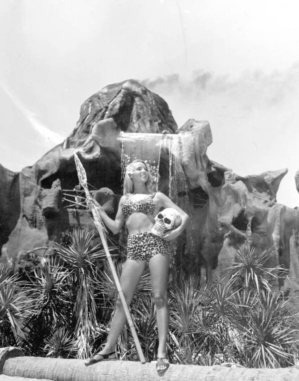 Model Melody May posing in front of volcano at the Jungle Land attraction in Panama City (1966).