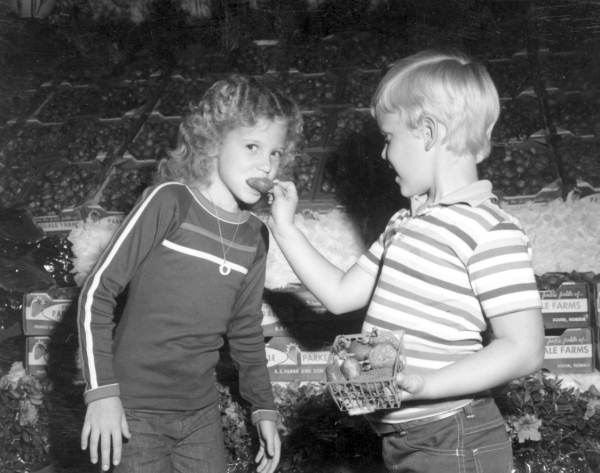 Two children eating strawberries at the annual Plant City Strawberry Festival (1978).