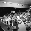 A family viewing a model exhibit at the Lionel Train Museum - Sarasota, Florida