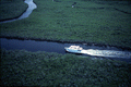 Aerial view showing a boat on a river at the John Pennekamp Coral Reef State Park - Key Largo, Florida.