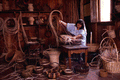 Basket weaver working at the Medieval Life attraction in Kissimmee, Florida.