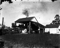 Mr. Paxton stands in front of still on old Daytona road.