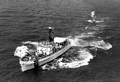 Coast Guard cutter "Cape Strait" with a Haitian refugee boat in tow.