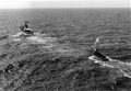 Coast Guard cutter "Cape Strait" with a Haitian refugee boat in tow.