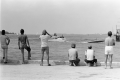 Cuban Americans scan arriving boats for friends and relatives during the Mariel Boatlift - Key West, Florida.