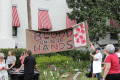 Gun-control activists with their sign at the Old Capitol during the Never Again Rally in Tallahassee.