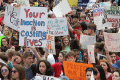 Close-up view showing student demonstrators with their signs at the Never Again Rally in Tallahassee.