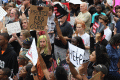 Close-up view showing student demonstrators and gun-control activists at the Never Again Rally in Tallahassee.