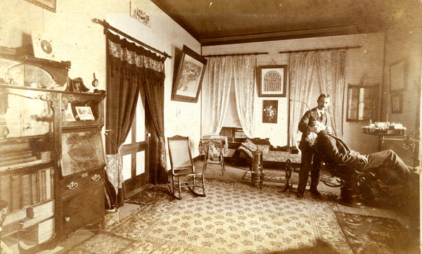 Dentist Charles N. Clark with a patient at his office at 93 Market Street in Apalachicola (February 1899).