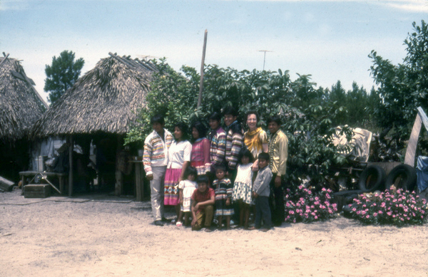 Photographer's wife Gladys posing with Susie Billie and her family at their camp in Naples.