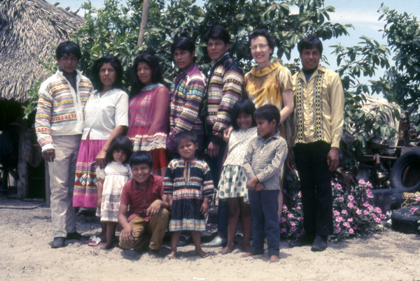 Photographer's wife Gladys posing with Susie Billie and her family at their camp in Naples.