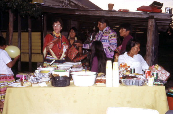 Photographer's wife Gladys giving gifts during Christmas feast at Susie Billie's village in Ft. Myers.