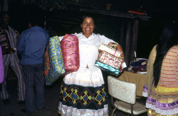 Susie Billie with Christmas presents at the village in Ft. Myers.