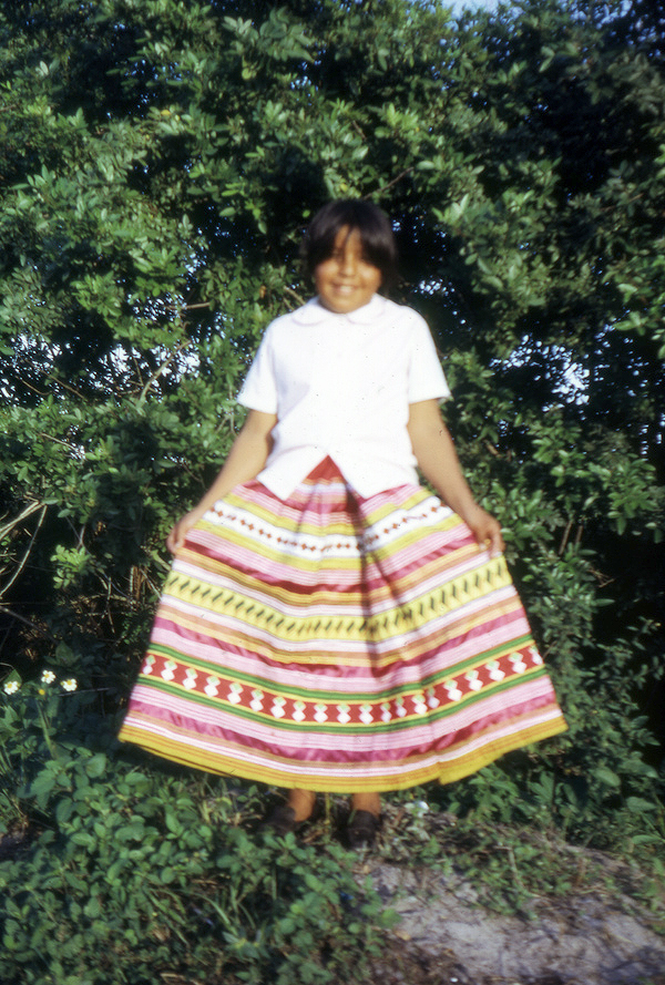 Marie Billie showing new skirt during Christmas celebration at Susie Billie's village in Ft. Myers.