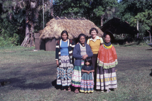 Photographer's wife Gladys posing with Seminole Indians from the Billie family.