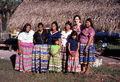 Photographer's wife Gladys posing with Seminole Indians from the Billie family.
