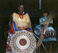 Susie Billie weaving sweetgrass with her granddaughter Ashley.