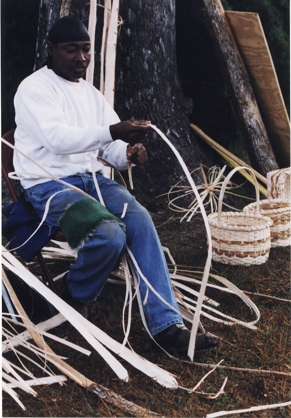 Alphonso Jennings making baskets during the Greenville Country Christmas Festival.