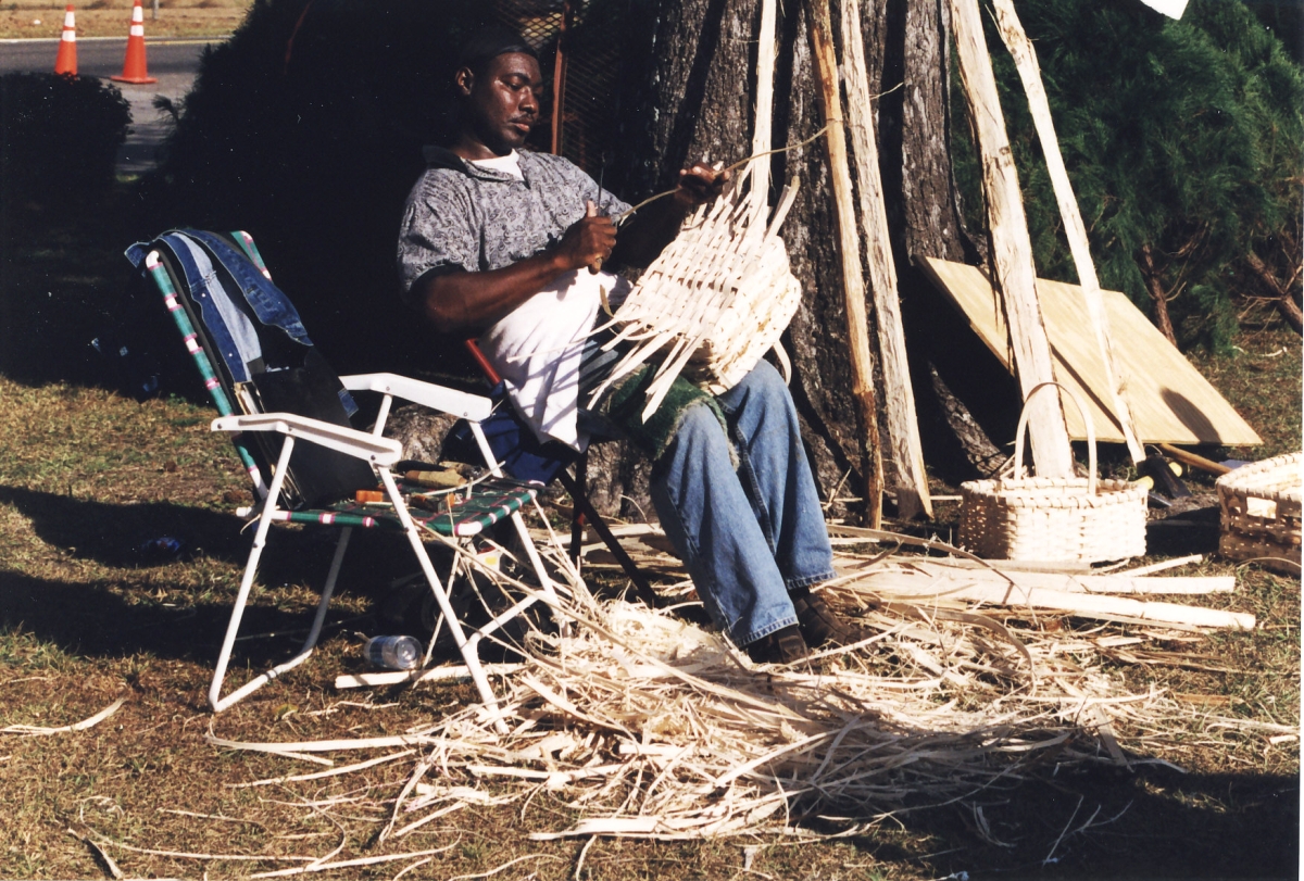 Alphonso Jennings making baskets during the 2002 Greenville Country Christmas Festival.
