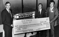 Akio Makiyama, Chairman of Maglev Transit, Inc (right)presents a check to Governor Bob Martinez (left) and Chairman Malcolm Kirschenbaum (center right) - Tallahassee, Florida.