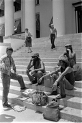 A group sits on the capitol steps in order to focus on the homeless problem - Tallahassee, Florida