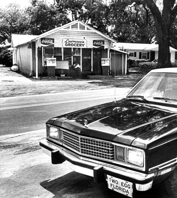 Street view of Lawrence's grocery in Two Egg. This was the last store open in town. Note the license plate on the car reading 