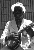 "Washboard Bill" Cooke playing a "banjo uke" at the Florida Folk Festival - White Springs, Florida.