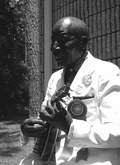 "Washboard Bill" Cooke playing a "banjo uke" at the Florida Folk Festival - White Springs, Florida.