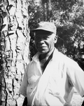 Portrait of Harry Cooper at the Stephen Foster Center during a turpentine demonstration in White Springs, Florida.