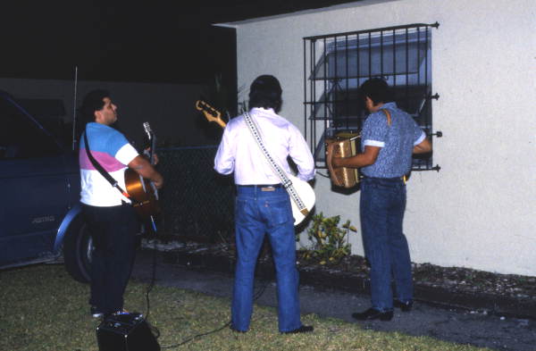 View showing musicians performing Mother's Day serenades in Homestead, Florida.