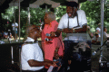 Street crier Tommy Walton performing with Blind Willie James and "Diamond Teeth" Mary McClain at the 1991 Florida Folk Festival.
