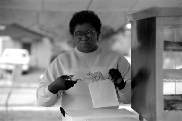 Jamaican American woman from Patties and Ting packing Jamaican beef patties at Zora Neale Hurston Festival- Eatonville, Florida